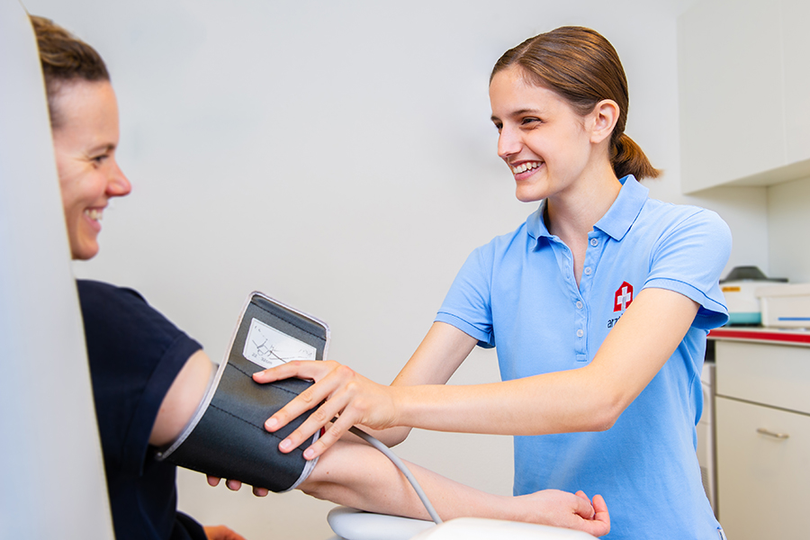 Nurse taking patients blood